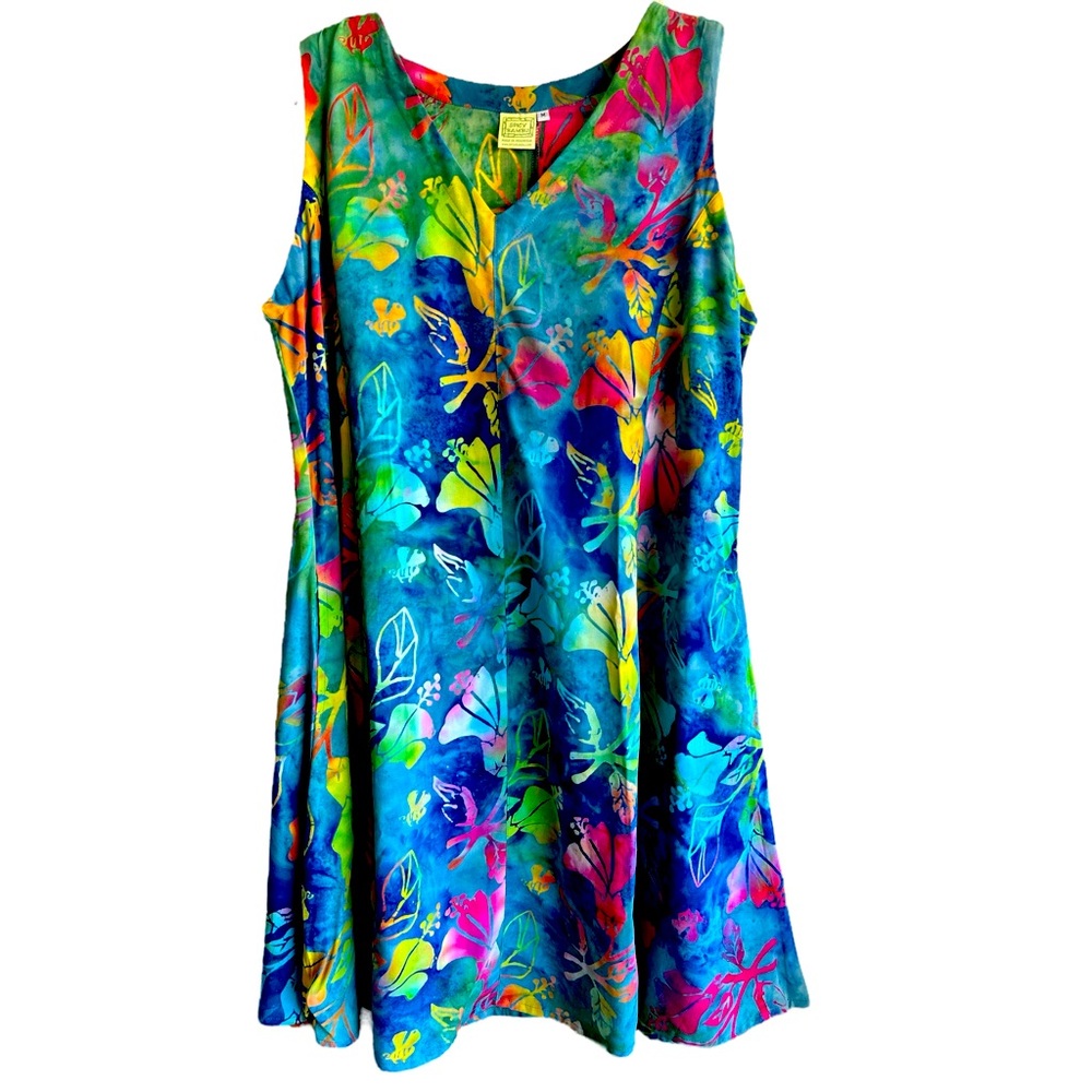 Beautiful knee length v neck batiked rayon dress with pockets . Machine wash